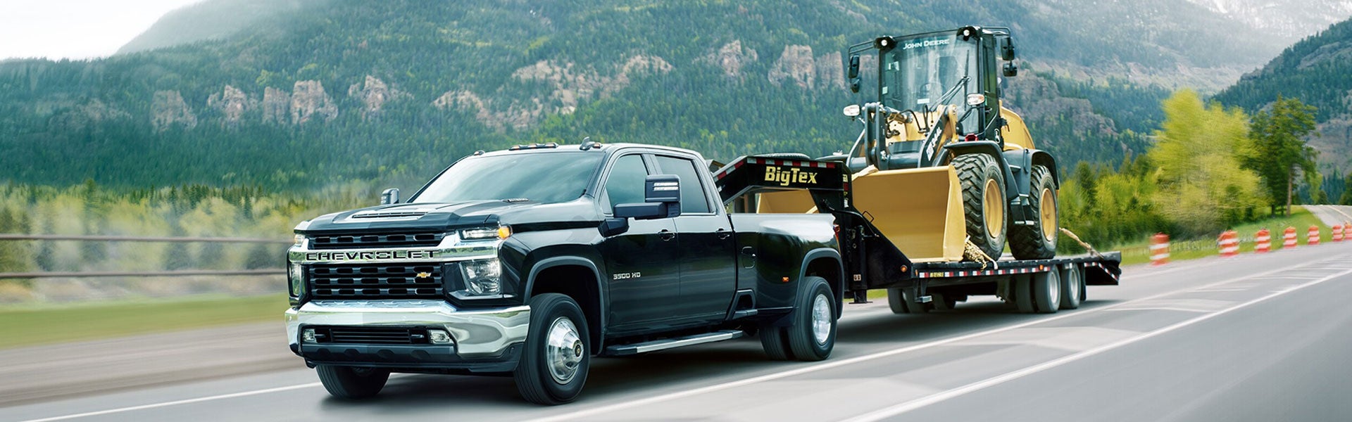Chevrolet Silverado 3500 HD towing a large truck
