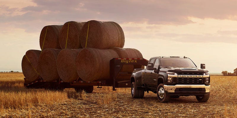 Chevrolet Silverado parked in a farm field